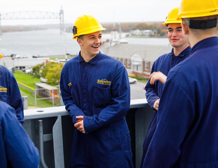 cadets in boiler suits on the ship